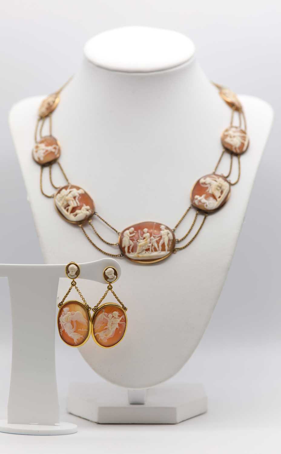 Lot 35 - An early 19th century carved shell cameo necklace and earrings suite