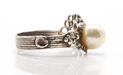 Lot 234 - A sterling silver single stone cultured pearl ring, by Gerda Flockinger
