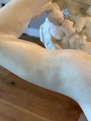 Lot 230 - A marble figure of a crouching faun