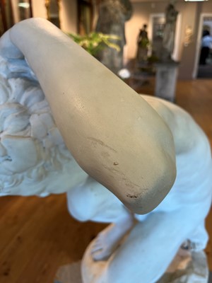 Lot 230 - A marble figure of a crouching faun
