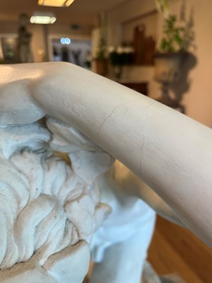 Lot 230 - A marble figure of a crouching faun