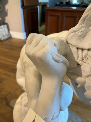 Lot 230 - A marble figure of a crouching faun