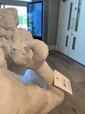 Lot 230 - A marble figure of a crouching faun