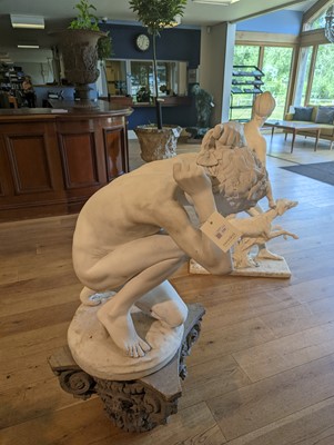 Lot 230 - A marble figure of a crouching faun