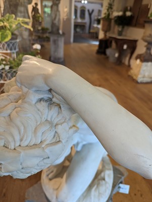 Lot 230 - A marble figure of a crouching faun