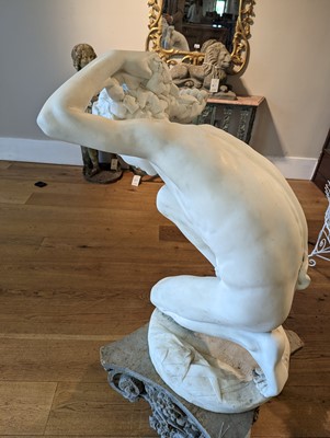 Lot 230 - A marble figure of a crouching faun