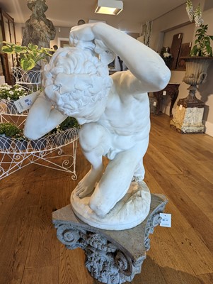 Lot 230 - A marble figure of a crouching faun