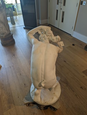 Lot 230 - A marble figure of a crouching faun