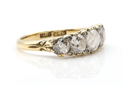 Lot 52 - A late Victorian graduated five stone diamond carved head ring