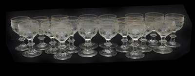 Lot 118 - A engraved and gilt glass service