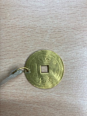 Lot 74 - A Chinese gold pendant