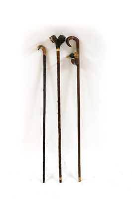 Lot 158 - Three modern carved walking sticks by Sam Wright of Norfolk