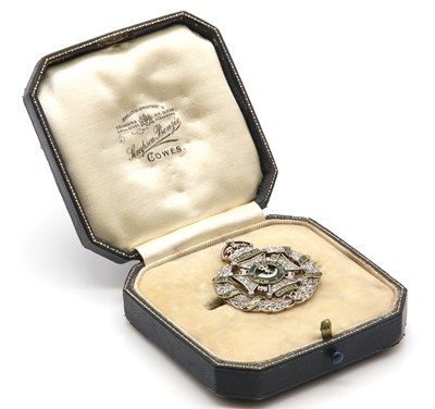 Lot 201 - A two colour gold Rifle Brigade diamond and enamel regimental brooch
