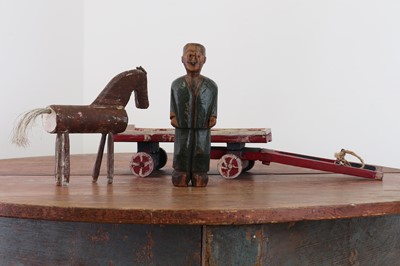 Lot 239 - A folk art carved wooden model of a horse, dray and drayman