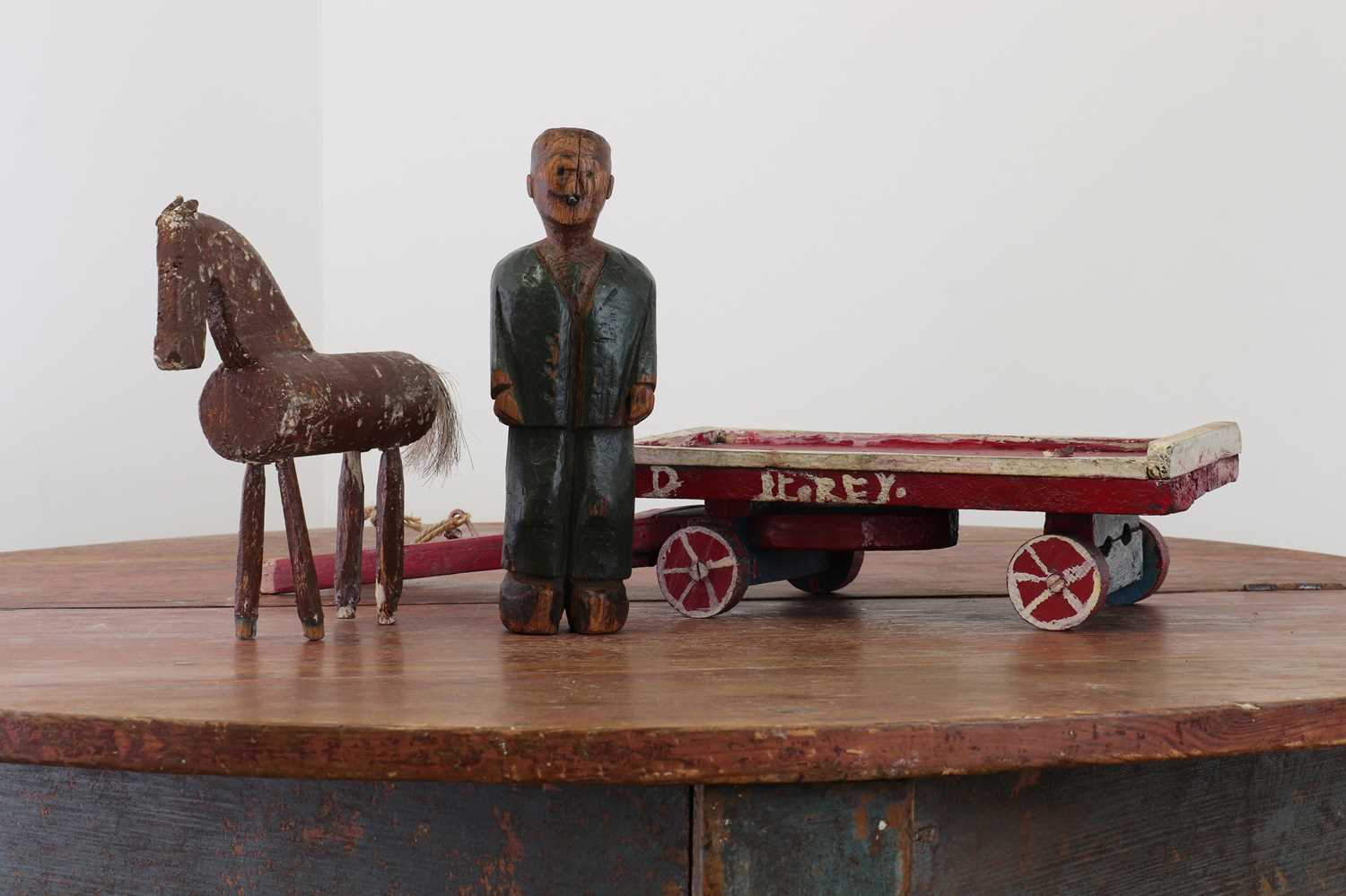 Lot 239 - A folk art carved wooden model of a horse, dray and drayman