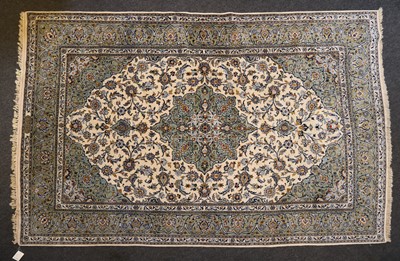 Lot 259 - A signed Kashan carpet