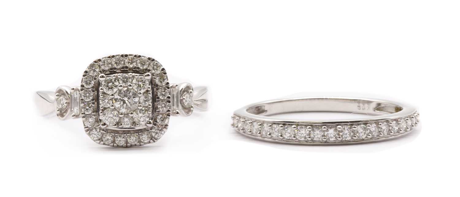Lot 110 - A 9ct white gold diamond set engagement and wedding ring set