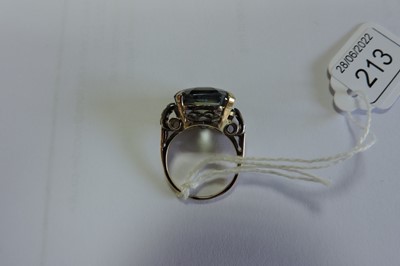 Lot 213 - A single stone sapphire ring with white sapphire set shoulders, c.1940