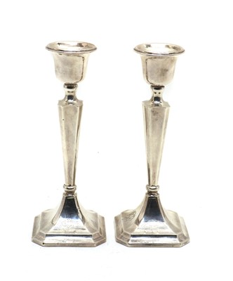Lot 21 - A pair of silver candlesticks