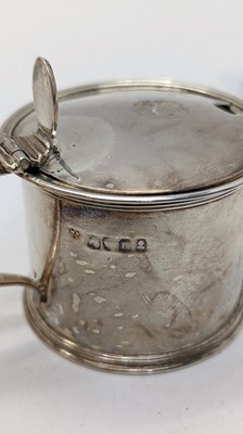 Lot 34 - A pair of George III silver drum mustards pots