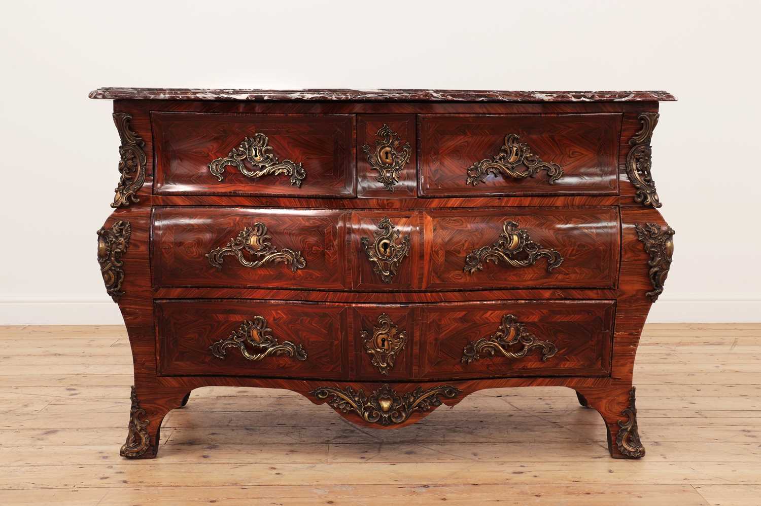 Lot 653 - A Louis XV kingwood bombé commode