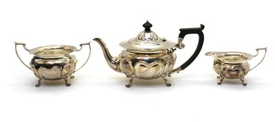 Lot 48 - A cased three piece Edwardian silver tea service
