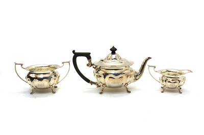Lot 48 - A cased three piece Edwardian silver tea service