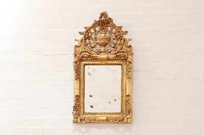 Lot 635 - A giltwood wall mirror