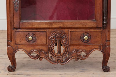 Lot 179 - A French walnut display cabinet