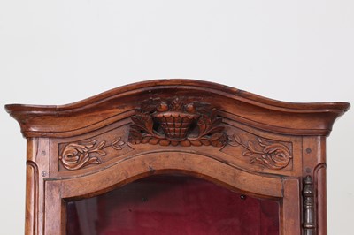 Lot 179 - A French walnut display cabinet