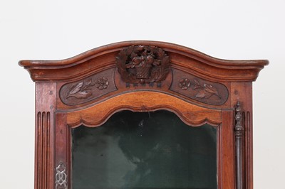 Lot 180 - A French walnut display cabinet
