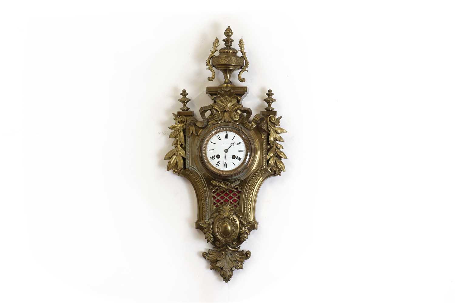 Lot 178 - A brass cartel clock