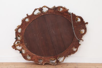 Lot 177 - A large Victorian oval gilt gesso wall mirror