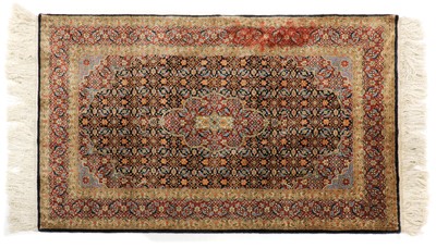 Lot 383 - A Persian silk rug