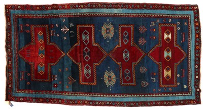 Lot 230 - A tribal wool rug
