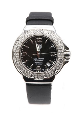 Lot 223 - A ladies' stainless steel Tag Heuer 'Formula 1' diamond set quartz strap watch, c.2006