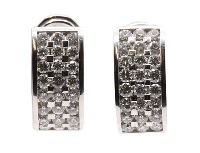 Lot 85 - A pair of 18ct white gold diamond set cuff earrings, by Picciotti, c.2002