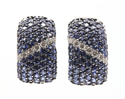Lot 115 - A pair of diamond and sapphire pavé set cuff style earrings