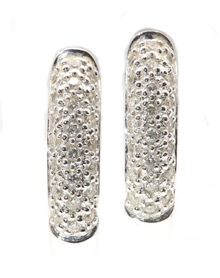 Lot 65 - A pair of 18ct white gold diamond set hinged hoop earrings