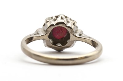 Lot 129 - A white gold ruby and diamond cluster ring