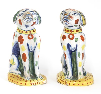 Lot 207 - A pair of delft figures in the form of seated dogs