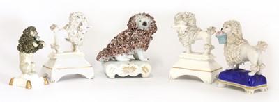Lot 205 - A group of five Staffordshire pottery poodles
