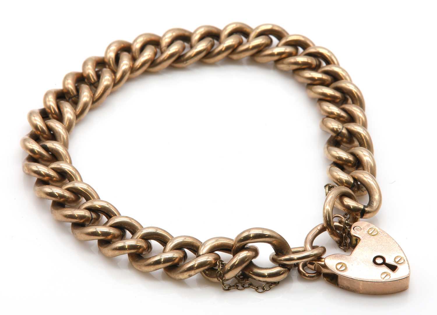 Lot 76 - An Edwardian 9ct gold hollow curb link bracelet