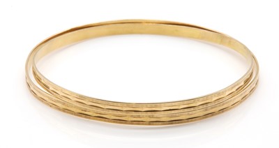 Lot 336 - A pair of 18ct gold flat section bangles