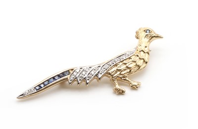 Lot 82 - A 9ct gold sapphire and diamond set bird brooch