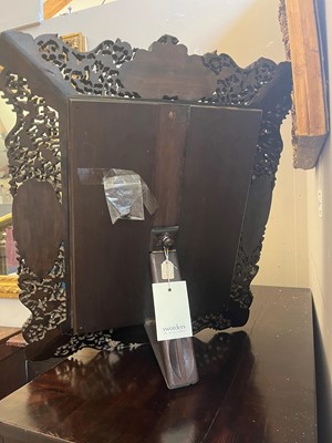 Lot 129 - A pierced and carved cedar mirror