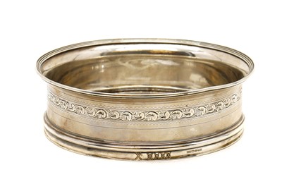 Lot 49 - A George III style silver wine coaster