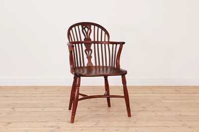 Lot 283 - A George III yew and elm low hoop-back Windsor chair