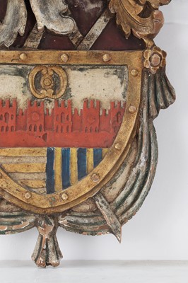 Lot 278 - A painted and parcel-gilt limewood coat of arms