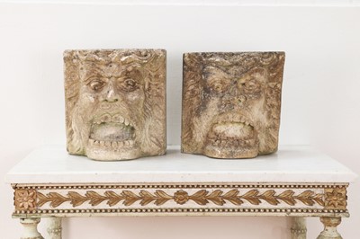 Lot 568 - A near pair of carved composite stone corbels